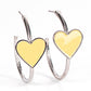 Kiss Up - Yellow Heart Hoop Earrings a charming Illuminating heart adorns the front of a classic silver hoop resulting in a whimsical fashion. Earring attaches to a standard post fitting. Hoop measures approximately 1 1/4" in diameter.  Sold as one pair of hoop earrings.  Paparazzi Jewelry is lead and nickel free so it's perfect for sensitive skin too!