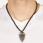 Get Your ARROWHEAD in the Game - Black Arrow Urban Necklaces dainty silver accents are knotted in place along a braided black cord below the collar. Stamped and hammered in tribal inspired patterns, a rustic silver arrowhead pendant swings from the earthy display for an authentic finish. Features a button loop closure. Sold as one individual necklace.