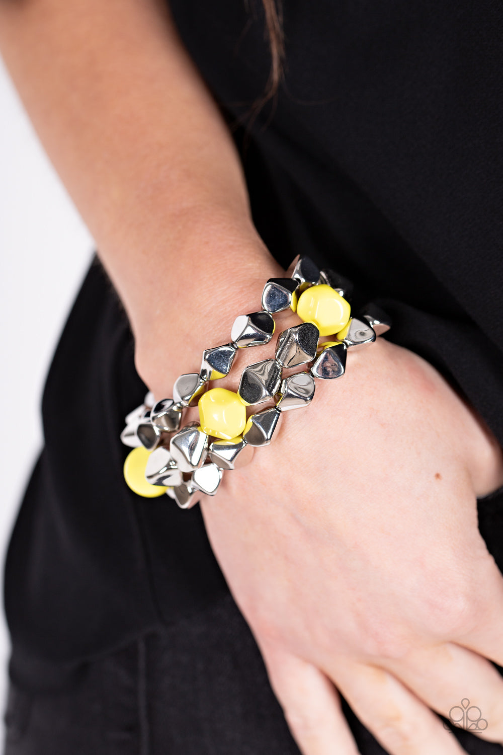 A Perfect TENACIOUS - Yellow Beaded Bracelets infused with pops of Illuminating accents, a faceted series of silver beads are threaded along stretchy bands around the wrist for a flashy fashion.  Sold as one set of three bracelets.