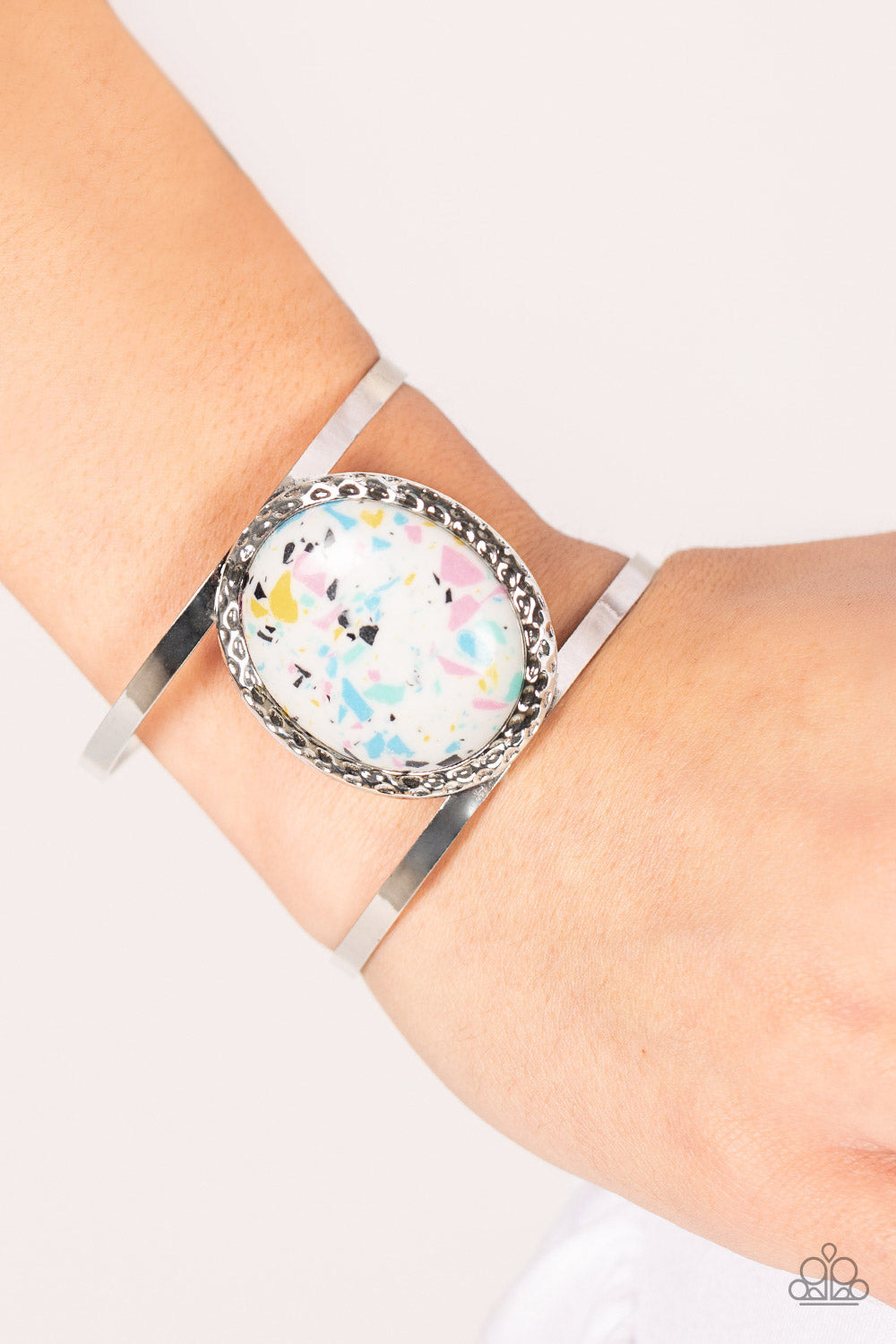 Tantalizing Terrazzo - Multi Stone Bracelets featuring a colorful terrazzo finish, an oversized multi-colored stone is pressed into the center of a hammered silver frame atop a layered silver cuff for a modern stone look.  Sold as one individual bracelet.