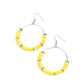 Loudly Layered - Yellow Floral Earrings infused with studded silver floral-shaped rings, a sunny collection of rubbery Illuminating flowers are threaded along a dainty wire hoop for a whimsical pop of color. Earring attaches to a standard fishhook fitting.  Sold as one pair of earrings.