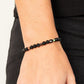 Interstellar Solitude - Black Stone Oil Spill Bracelets - Paparazzi Accessories a dainty collection of natural-finished black stone beads and faceted metallic oil spill cube beads are threaded along a stretchy band around the wrist for an earthy flair.  Sold as one individual bracelet.