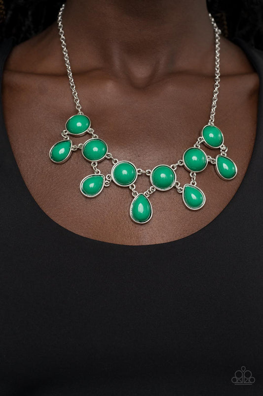 Paparazzi Accessories - Very Valley Girl - Green Necklaces a refreshing collection of Leprechaun teardrop beads links to the bottom row of oversized round Leprechaun beads, interlocking into a glamorous pop of color below the collar. Features an adjustable clasp closure.  Sold as one individual necklace. Includes one pair of matching earrings.