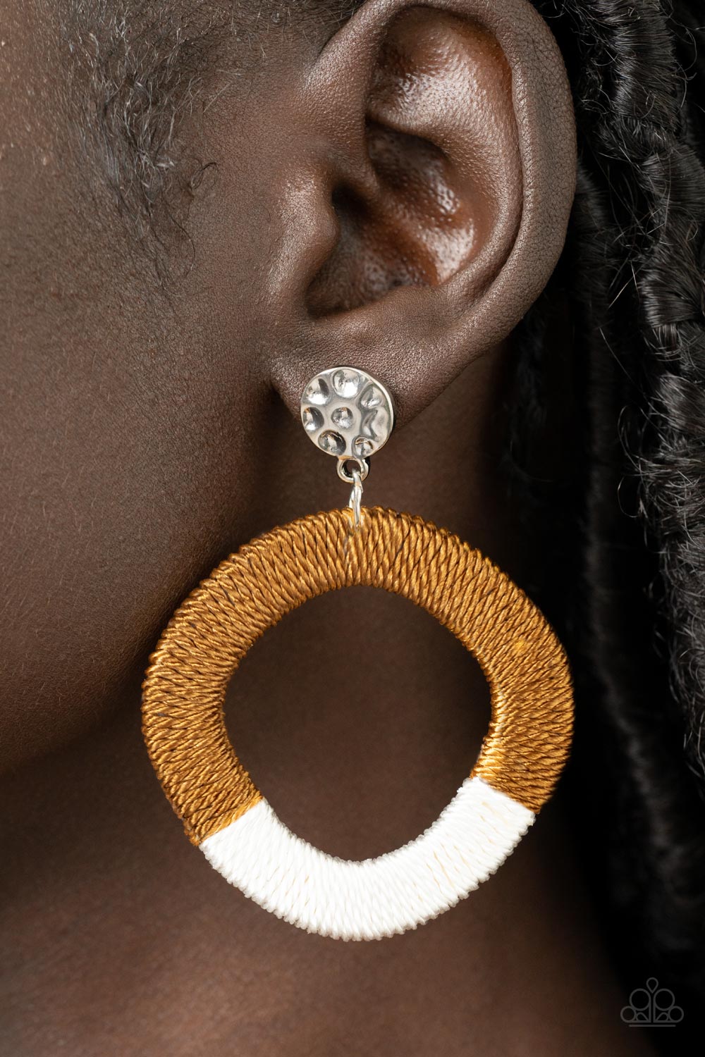 Thats a WRAPAROUND - Brown Threaded Earrings a hammered silver disc gives way to a wooden frame decoratively wrapped in shiny white and brown threaded accents, creating a colorful lure. Earring attaches to a standard post fitting.  Sold as one pair of post earrings.
