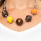 Paparazzi Eco Extravaganza - Multi Necklaces an infused with yellow and orange wooden beads, a mismatched assortment of studded silver hoops, textured silver rings, and oversized brown wooden beads delicately connect across the chest for a stylishly handcrafted fashion. Features an adjustable clasp closure.  Sold as one individual necklace. Includes one pair of matching earrings.