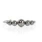 Gradually increasing in size, an oversized collection of gunmetal beads are threaded along a dainty gunmetal cuff for a dramatic industrial display.  Sold as one individual bracelet.
