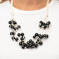 Paparazzi Accessories - Yacht Catch - Black Necklaces a collection of bubbly black beads are knotted in place along strands of white cording, resulting in boisterous layers below the collar. Features a button-loop closure.  Sold as one individual necklace. Includes one pair of matching earrings.