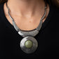 Paparazzi Accessories EMPRESS-ive Resume - Green Necklaces featuring hammered, scratched, and linear patterns, an antiqued assortment of gently curving silver frames boldly links below the collar. Dotted with an oversized Olive Branch stone center, a rustic silver frame radiating with circular texture swings from the bottom for a dramatically earthy flair. Features an adjustable clasp closure.  Sold as one individual necklace. Includes one pair of matching earrings.