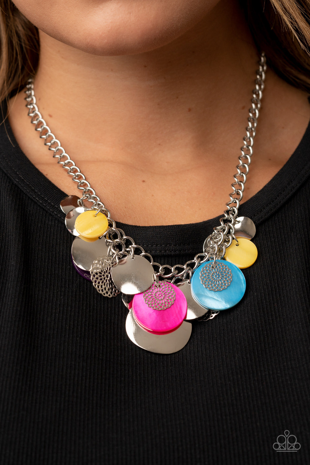 Paparazzi Accessories - Oceanic Opera - Multi Necklaces a summery collection of bent silver discs, multicolored shell-like discs, and silver mandala-like accents cascades from a pair of layered silver chains, resulting in a bubbly and boisterous fringe below the collar. Features an adjustable clasp closure.  Sold as one individual necklace. Includes one pair of matching earrings.