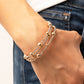 Spontaneous Shimmer - Gold Coil Bracelet spontaneously interrupted by glistening gold beads, a sparkly strand of white rhinestones coils around the wrist, resulting in an irresistible infinity wrap bracelet.  Sold as one individual bracelet.
