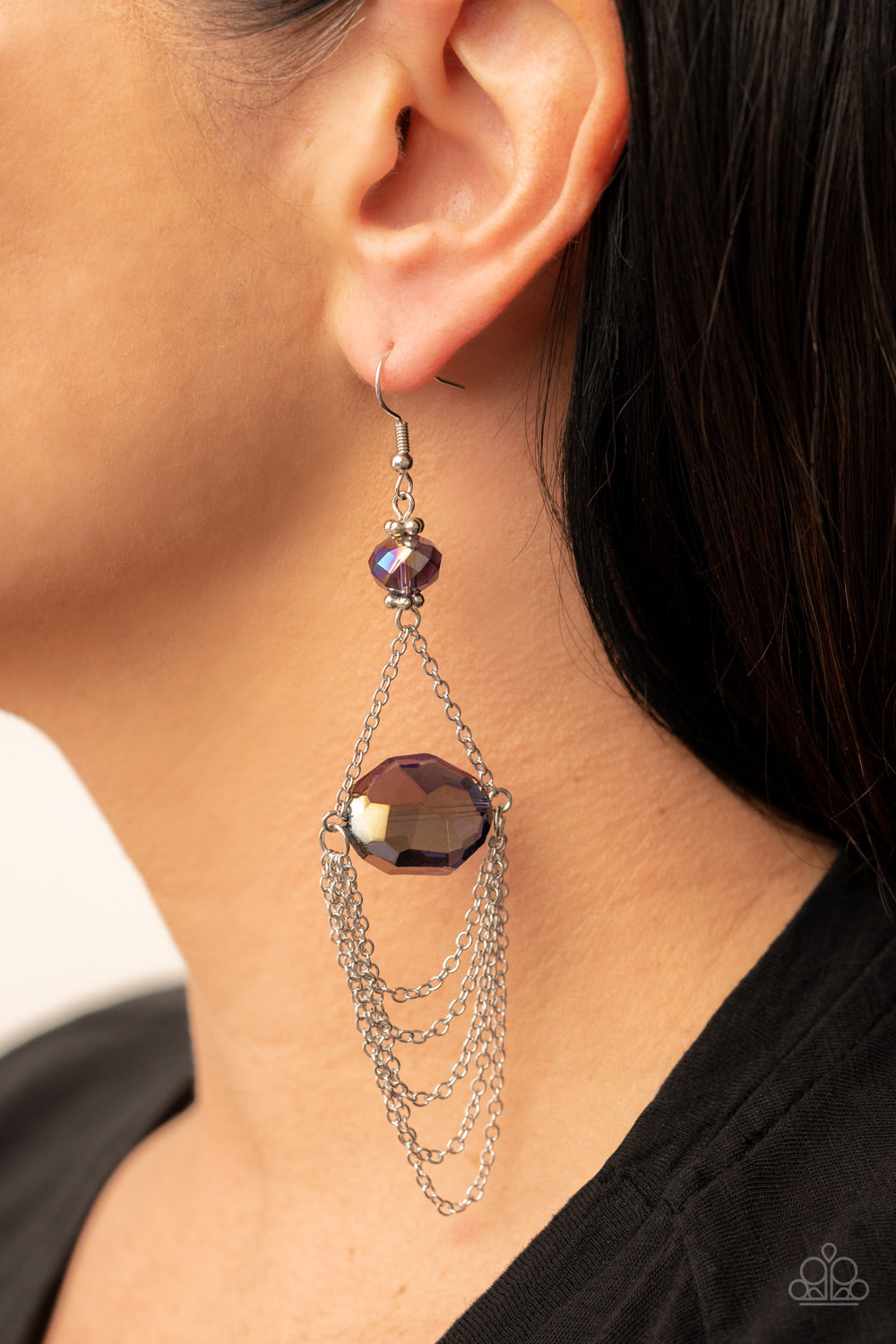Ethereally Extravagant - Purple Iridescent Gem Earrings tiers of dainty silver chains delicately layer from an oversized oval iridescent purple gem that is suspended from a faceted matching purple crystal-like bead, resulting in an ethereal chandelier. Earring attaches to a standard fishhook fitting.  Sold as one pair of earrings.
