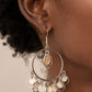Paparazzi Cabana Charm - White Earrings a summery collection of white shell-like discs and dainty silver rings dances from the top and bottom of a shiny silver hoop, resulting in a beach inspired fringe. Earring attaches to a standard fishhook fitting.  Sold as one pair of earrings.
