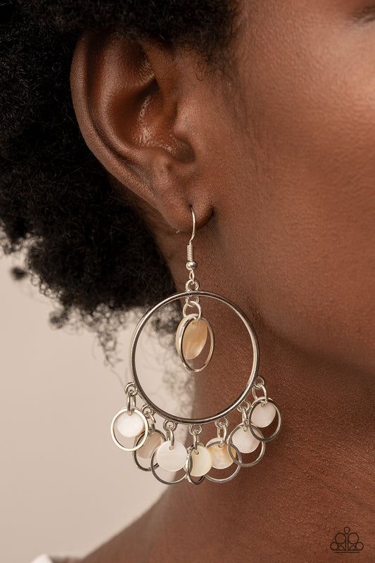 Paparazzi Cabana Charm - White Earrings a summery collection of white shell-like discs and dainty silver rings dances from the top and bottom of a shiny silver hoop, resulting in a beach inspired fringe. Earring attaches to a standard fishhook fitting.  Sold as one pair of earrings.