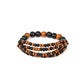 Oceania Oasis - Black Wood Bracelets stretchy strands of dainty brown and black wooden beads attach to a single strand of oversized brown and black wooden beads, resulting in colorful layers around the wrist.  Sold as one individual bracelet.