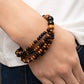 Oceania Oasis - Black Wood Bracelets stretchy strands of dainty brown and black wooden beads attach to a single strand of oversized brown and black wooden beads, resulting in colorful layers around the wrist.  Sold as one individual bracelet.