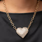 Heartbreakingly Blingy - Gold Rhinestone Heart Necklaces a dramatically oversized gold heart frame is encrusted in row after row of dazzling white rhinestones, resulting in a heart-racing sparkle below the collar. Features an adjustable clasp closure.  Sold as one individual necklace. Includes one pair of matching earrings.
