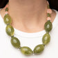 Paparazzi Accessories - Belle of the Beach - Green Necklaces featuring cloudy acrylic finishes, flat Olive Branch and coral discs alternate along an invisible wire, giving way to an oversized collection of cloudy oval Olive Branch beads for an ethereal pop of color below the collar. Features an adjustable clasp closure.  Sold as one individual necklace. Includes one pair of matching earrings.