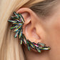 Paparazzi Because Ice Said So - Multi Oil Spill Earrings an explosion of marquise cut oil spill rhinestones delicately climb the ear, coalescing into a smoldering frame. Earring attaches to a standard post fitting. Features a clip-on fitting at the top for a secure fit.  Sold as one pair of ear climbers.