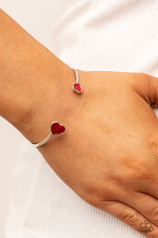 Unrequited Love - Red Heart Cuff Bracelets enhanced with glitzy red rhinestones, two silver hearts adorn the ends of a silver band that curls around the wrist for a flirtatious open-faced style cuff.  Sold as one individual bracelet.
