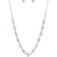 True Love Trinket - Pink Heart Necklaces a pink rhinestone heart charm dances from a strand of white and pink rhinestones, resulting in a flirtatious sparkle below the collar. Features an adjustable clasp closure.  Sold as one individual necklace. Includes one pair of matching earrings.