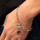 Til DAZZLE Do Us Part - Red Heart Toggle Bracelets bordered in glassy white rhinestones, a red heart shaped gem sparkles from a toggle closure at the center of an oval silver linked chain for a flirtatious fashion around the wrist. Features a toggle closure.  Sold as one individual bracelet.