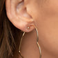 Harmonious Hearts - Gold Clip-On Heart Earrings glistening gold bar delicately curves into an oversized heart frame, resulting in a heart-stopping shimmer. Earring attaches to a standard clip-on fitting.  Sold as one pair of clip-on earrings.