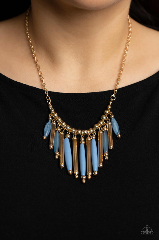 Paparazzi Accessories Bohemian Breeze - Blue Necklace flanked by dainty gold beads, cylindrical gold and glassy Spring Lake beads alternate along a gold beaded chain, fanning out into a colorful fringe below the collar. Features an adjustable clasp closure.  Sold as one individual necklace. Includes one pair of matching earrings.