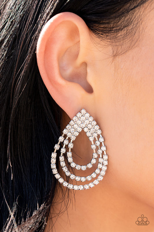 Paparazzi Accessories Take a POWER Stance - White Rhinestone Convention Earrings loops of glassy white rhinestones ripple out from the bottom of a stationary triangular fitting that is dotted in glittery white rhinestones, resulting in a timeless teardrop chandelier. Earring attaches to a standard post fitting.  Sold as one pair of post earrings.  2022 Glow Convention 