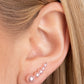 Paparazzi Accessories - Dropping into Divine - Pink Pearl Ear Crawler a bubbly cluster of dainty pink pearls decrease in size as they climb the ear, curving into an effervescent accent. Features an extended post fitting that climbs the back of the ear and can be pressed together for a more secure fit.  Sold as one pair of ear crawlers.