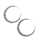 Gradually increasing in size, glistening gunmetal beads are threaded along an oversized gunmetal hoop for a gritty and glamorous effect. Earring attaches to a standard post fitting. Hoop measures approximately 2 1/2" in diameter.  Sold as one pair of hoop earrings.