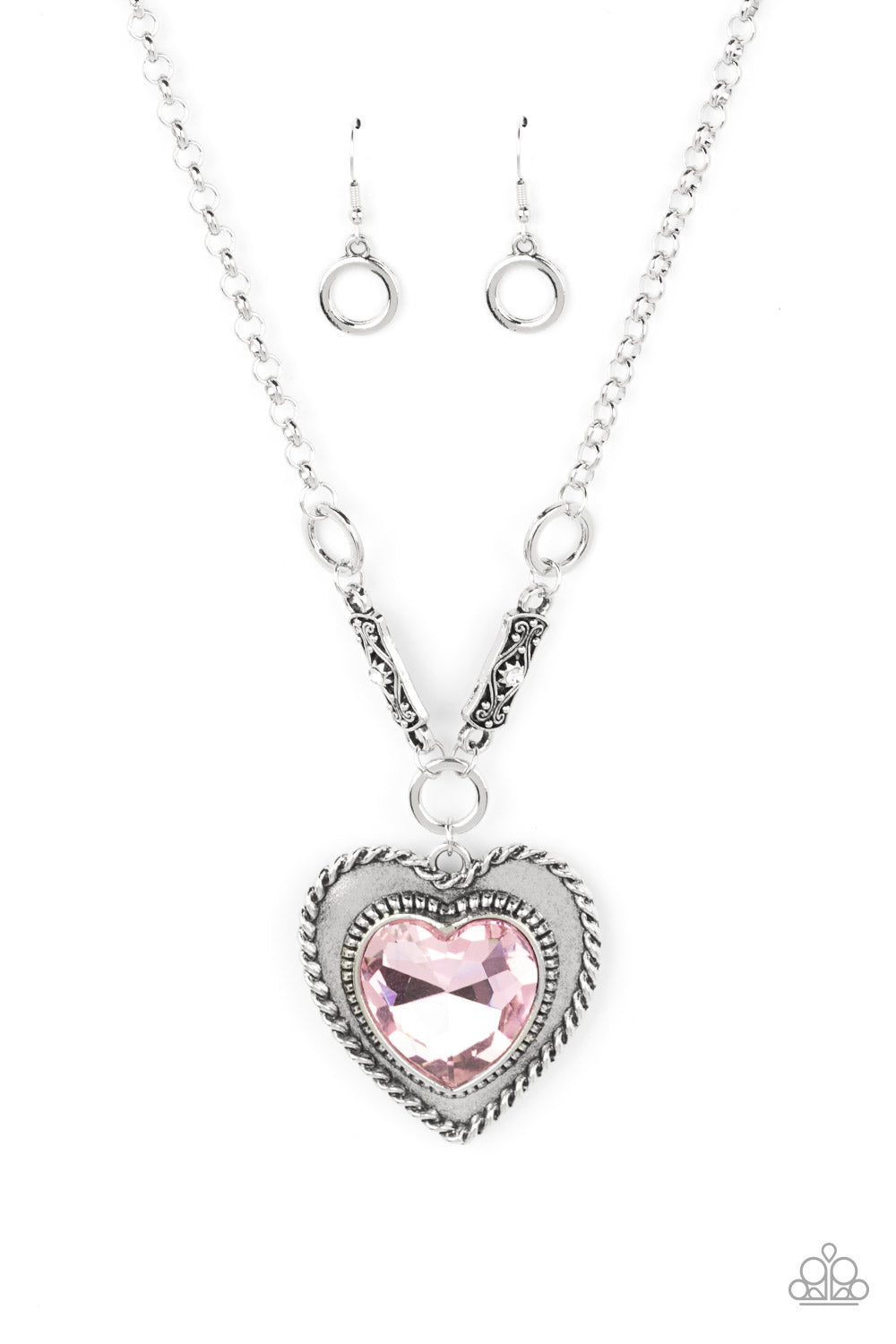 Paparazzi Accessories Heart Full of Fabulous - Pink Heart Necklaces bordered in spun silver ribbons, an oversized Gossamer Pink heart gem is pressed into a silver heart frame below the collar. The flirtatious pendant attaches to silver rings and decorative silver frames dotted in white rhinestones, resulting in a dash of vintage inspired romance. Features an adjustable clasp closure.  Sold as one individual necklace. Includes one pair of matching earrings.