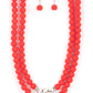 Threaded along invisible wires, matte-finished Poinciana beads give way to center sections of white rhinestone encrusted rings and faceted silver beads. The vivacious display layers below the collar, creating a summery splash of color. Sold as one individual necklace. Includes one pair of matching earrings. he wrist. White rhinestone encrusted rings flank a trio of faceted silver beads along a stretchy row of matte-finished Poinciana beads, creating a summery splash of color around the wrist.