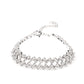 Paparazzi Accessories - Seize the Sizzle - White Rhinestone Bracelets set in pronged silver settings, pairs of icy white rhinestones haphazardly stack around the wrist in sizzling rows of shimmer. Features an adjustable clasp closure.  Sold as one individual bracelet.