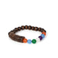 Paparazzi Accessories - Tropical Kaleidoscope - Multi Urban Bracelets an infused with brown wooden discs and beads, a glassy collection of rainbow-colored beads are threaded along stretchy bands around the wrist for an adventurous pop of color.  Sold as one individual bracelet.