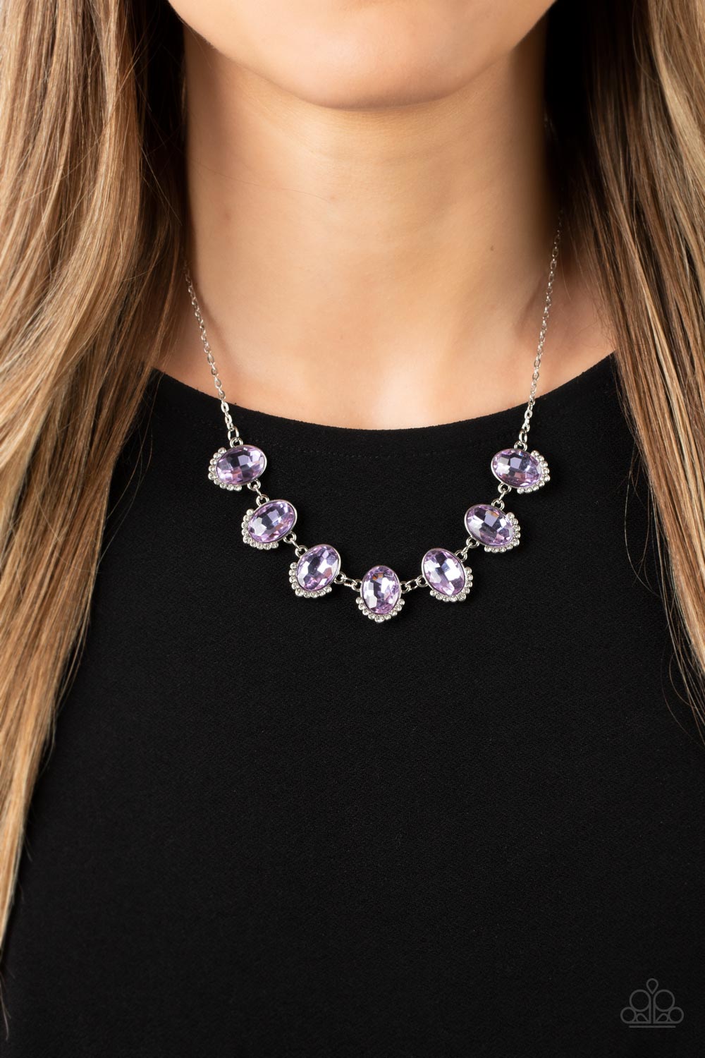 Unleash Your Sparkle - Purple Rhinestone Necklaces dainty rows of glittery white rhinestones gently curve around the bottoms of oversized Very Peri oval gems. The sparkly frames delicately connect below the collar, creating a colorful centerpiece. Features an adjustable clasp closure.  Sold as one individual necklace. Includes one pair of matching earrings.