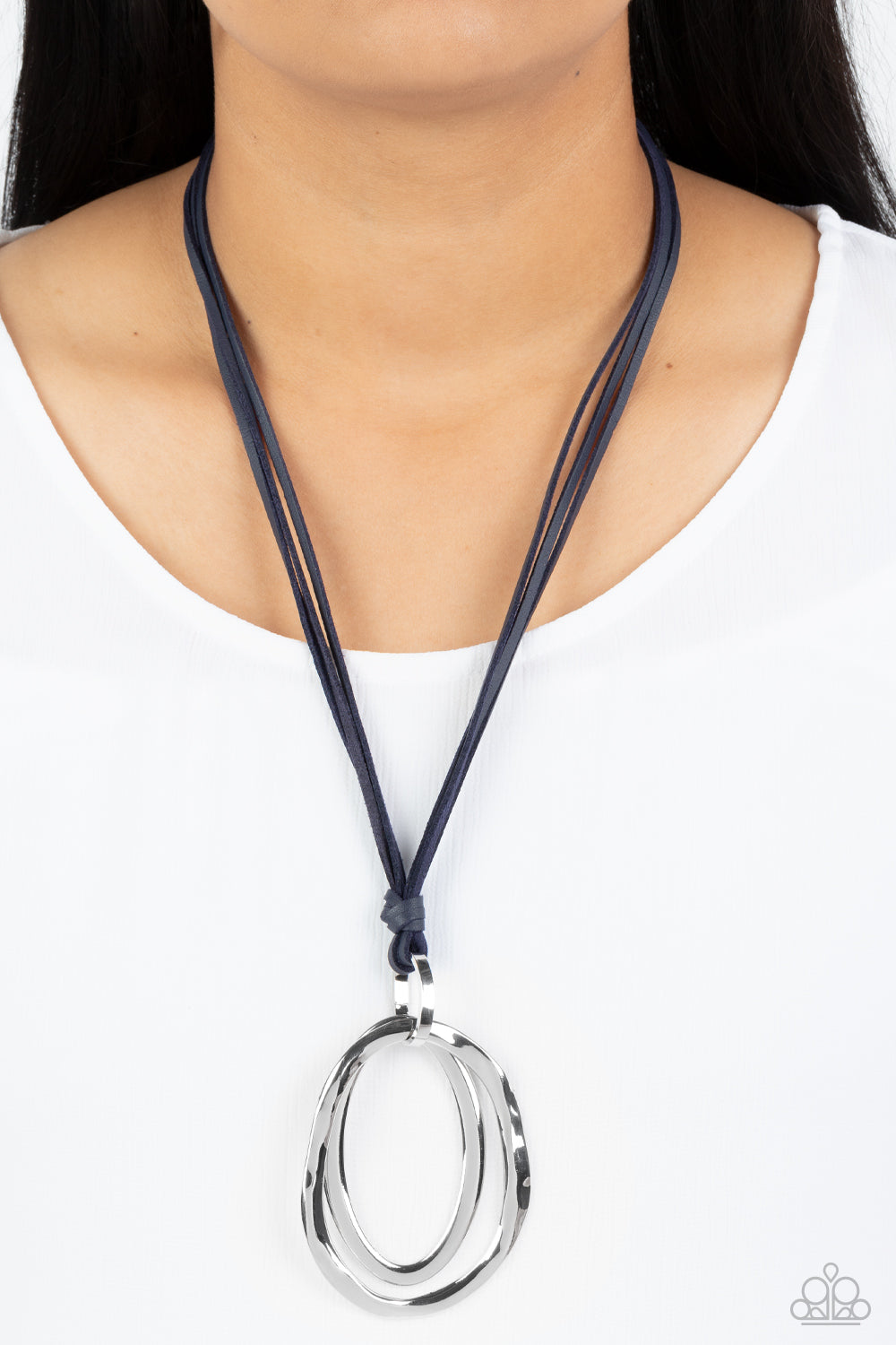 Paparazzi Accessories - Long OVAL-due - Silver Necklace long strips of navy blue leather knot around a silver link where a mismatched pair of smooth and hammered silver ovals swing from the bottom, resulting in a rustic pendant. Features an adjustable clasp closure.  Sold as one individual necklace. Includes one pair of matching earrings.