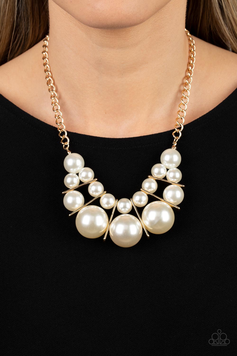 Paparazzi Accessories - Challenge Accepted - Gold Pearl Necklace separated by rectangular gold frames, bubbly rows of classic and oversized white pearls are threaded along invisible wires at the bottom of a chunky gold chain for an effervescent explosion below the collar. Features an adjustable clasp closure.  Sold as one individual necklace. Includes one pair of matching earrings.