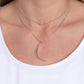 Rose Gold Necklaces two dainty rose gold chains delicately layer below the collar. A white crystal-like bead sparkles at the center of the uppermost chain while a rose gold half moon pendant swings from the bottom of the display for a mystical finish. Features an adjustable clasp closure.  Sold as one individual necklace. Includes one pair of matching earrings.