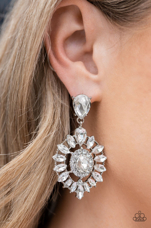 Paparazzi Accessories - My Good LUXE Charm - White Rhinestone Earrings bordered in dainty white rhinestones, an oval white gem is pressed into the center of an explosion of white marquise cut rhinestones. The icy frame swings from the bottom of a solitaire teardrop rhinestone, adding flirtatious movement to the jaw-dropping display. Earring attaches to a standard post fitting.  Sold as one pair of post earrings.
