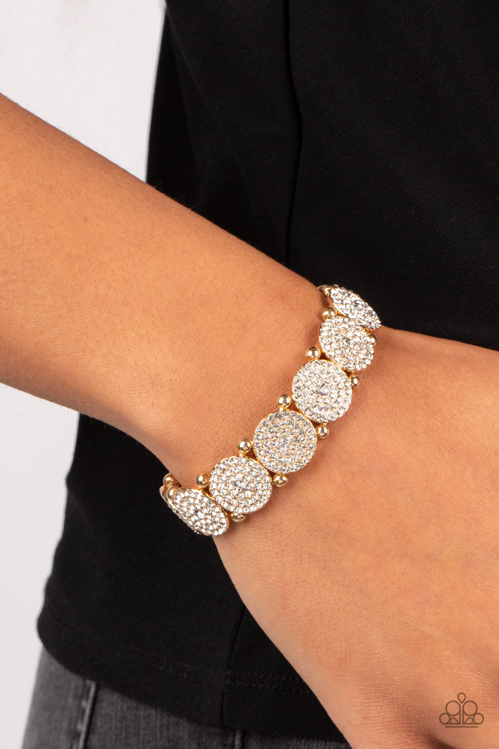 Paparazzi Accessories - Palace Intrigue - Gold Rhinestone Bracelets separated by pairs of gold beads, icy white rhinestone encrusted gold frames glitter along stretchy bands around the wrist for a timeless twinkle.  Sold as one individual bracelet.