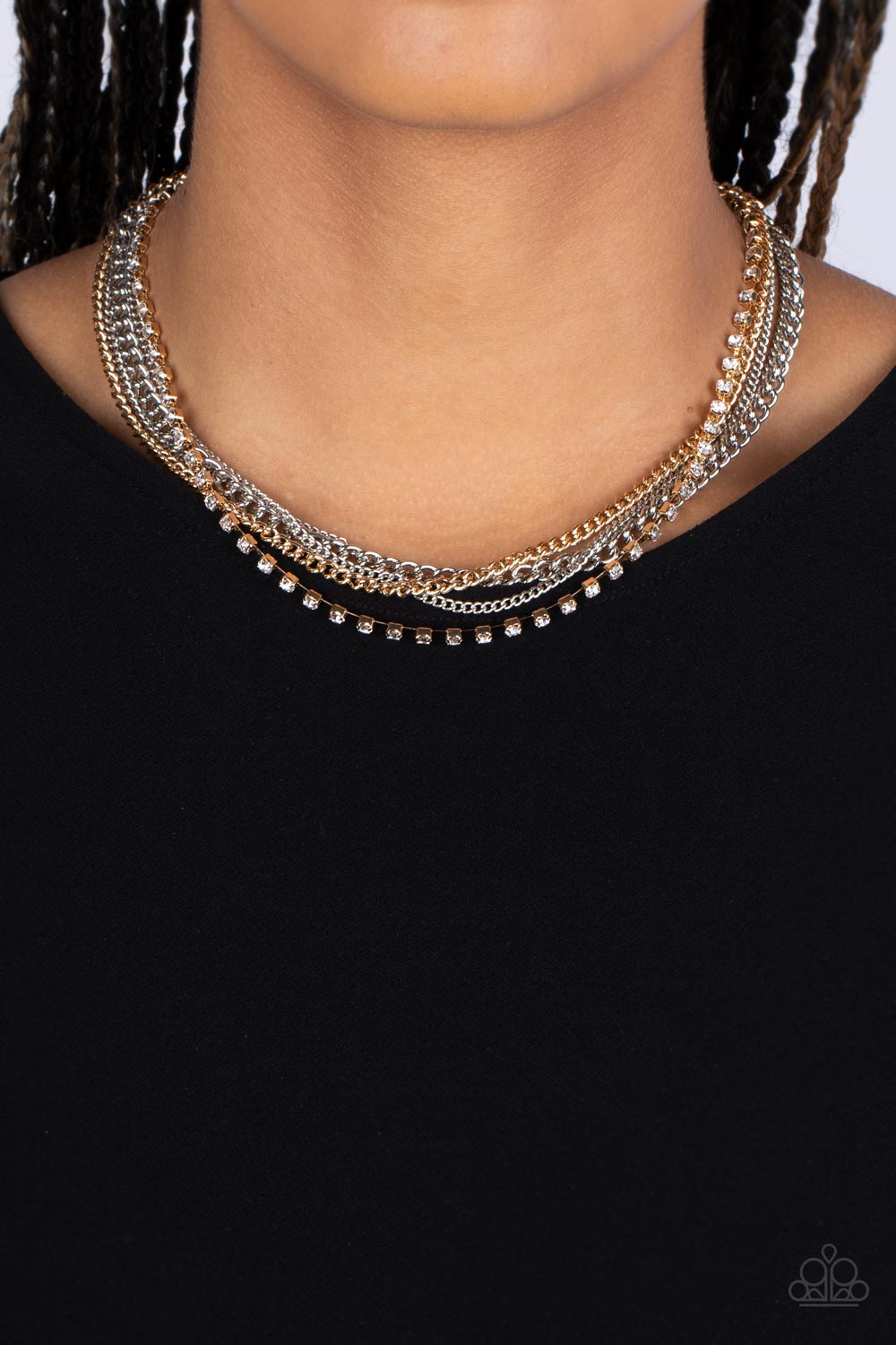 Paparazzi Accessories - Free to CHAINge My Mind - Multi Necklace a mashup of gold and silver chains collides with a strand of sparkling white rhinestones encased in gold fittings. The contrast of gritty gold and silver finishes and shimmery accents creates a brilliant display of grunge and glitz as the strands layer across the chest in an epic finish. Features an adjustable clasp closure.  Sold as one individual necklace. Includes one pair of matching earrings.