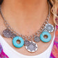 Paparazzi Accessories Western Zen - Blue Stone Convention Necklaces a collection of silver discs, embellished with intricate mandala-like designs, dances along a thick silver chain, with a pair of polished turquoise stone rings adding a pop of color to the rustic design. Features an adjustable clasp closure.  Sold as one individual necklace. Includes one pair of matching earrings.  2022 GLOW Convention Necklaces 