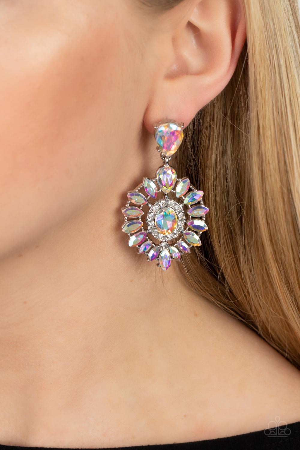 Paparazzi Accessories - My Good LUXE Charm - Multi Iridescent Earrings bordered in dainty white rhinestones, an iridescent gem is pressed into the center of an explosion of iridescent marquise cut rhinestones. The icy frame swings from the bottom of a solitaire iridescent teardrop rhinestone, adding flirtatious movement to the jaw-dropping display. Earring attaches to a standard post fitting. Due to its prismatic palette, color may vary.  Sold as one pair of post earrings.
