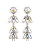 Paparazzi Accessories - Space Age Sparkle - Yellow Iridescent Earrings a silver sunburst frame wraps around a yellow iridescent gem as it gives way to an explosion of marquise-cut rhinestones in the same dreamy finish. The oblong frames swing dramatically from the ear, capturing and reflecting light at every turn. Earring attaches to a standard post fitting. Due to its prismatic palette, color may vary.  Sold as one pair of post earrings.