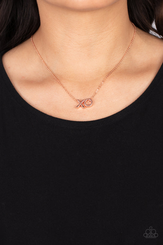 shiny copper letter "X" and a letter "O" in the same metallic sheen, slide along a classic shiny copper chain, creating a dainty, fun-loving design. Features an adjustable clasp closure.  Sold as one individual necklace. Includes one pair of matching earrings.