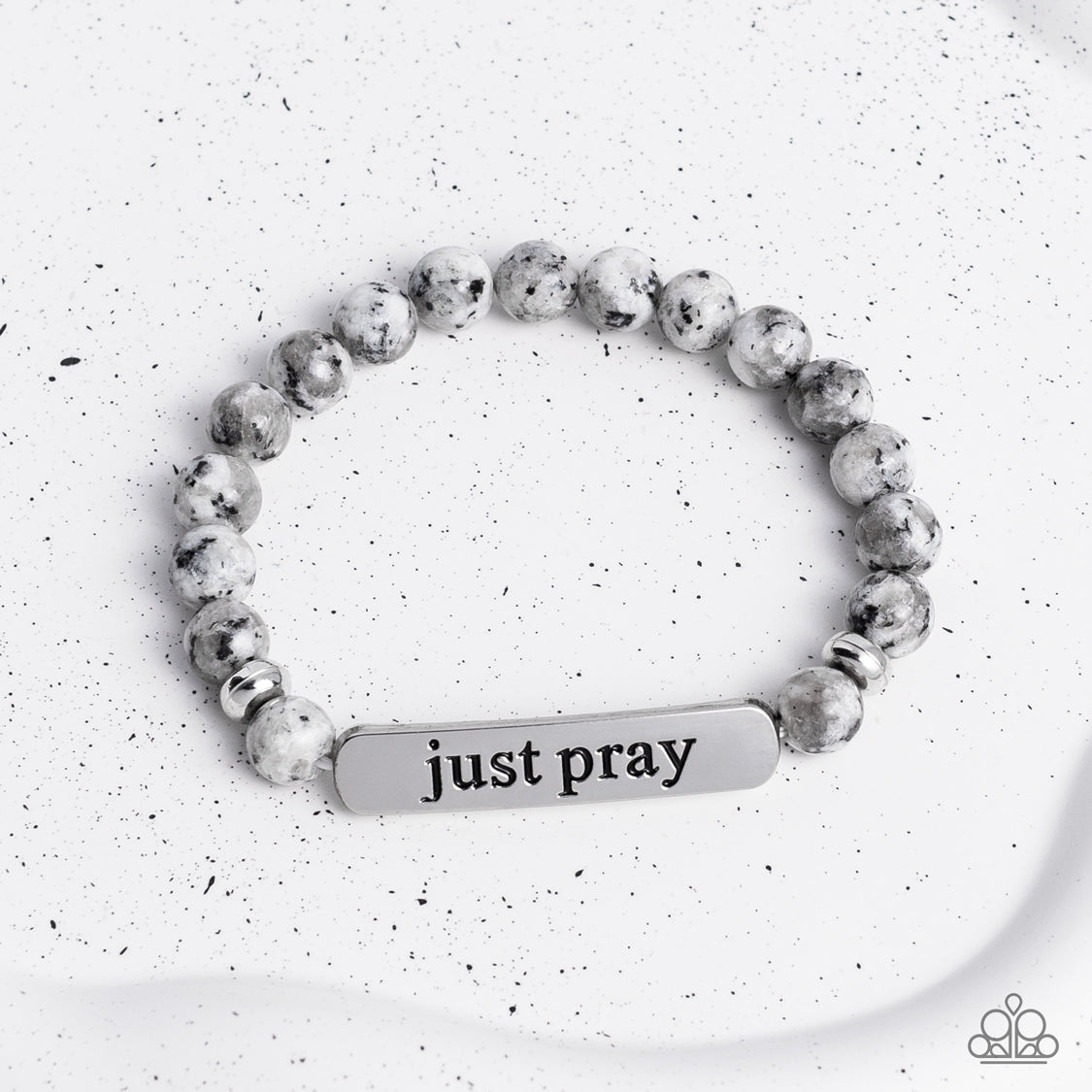 Paparazzi Accessories - Just Pray - Silver Inspirational Bracelets smooth, gray speckled stones are stretched across the wrist on an elastic stretchy band, with accents of silver beads sprinkled in. Meeting in the center of the stony display, a curved rectangular bar is stamped with the phrase "just pray" for an inspiring finish. As the stone elements in this piece are natural, some color variation is normal.  Sold as one individual bracelet.