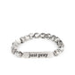 Paparazzi Accessories - Just Pray - Silver Inspirational Bracelets smooth, gray speckled stones are stretched across the wrist on an elastic stretchy band, with accents of silver beads sprinkled in. Meeting in the center of the stony display, a curved rectangular bar is stamped with the phrase "just pray" for an inspiring finish. As the stone elements in this piece are natural, some color variation is normal.  Sold as one individual bracelet.
