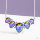 Paparazzi Accessories - Regally Refined - Multi Life of the Party Necklaces featuring a stellar UV shimmer, dramatic teardrop gems, gliding from a sleek, silver snake chain, are pressed into high-sheen silver casings, creating a colorful fringe below the collar. Linking each teardrop together, dainty white rhinestones border the tops and bottoms of each shape, creating additional eye-catching dazzle. Features an adjustable clasp closure. Due to its prismatic palette, color may vary.