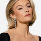 Paparazzi Accessories - LIGHT at the Opera - White 2023 EMP Earrings radiant clusters of white reflective teardrop, marquise-cut and round gems combine with classic white pearls to create an explosion of glitz that extends down the ear. Hanging from the bottom of the light-reflecting earring, a white, reflective teardrop gem swings for some eye-catching shimmer against a backdrop of high-sheen silver. Earring attaches to a standard post fitting.