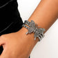 Paparazzi Accessories - First WINGS First - White 2023 EMP Butterfly Bracelets strung along elastic stretchy bands, a trio of silver and textured silver beads and accents wrap around the wrist. Featured atop the beaded collection, an oversized silver butterfly, with intricate details, is sprinkled with dainty white rhinestones across its wings and body, for a dramatically dazzling finish.  Sold as one individual bracelet.